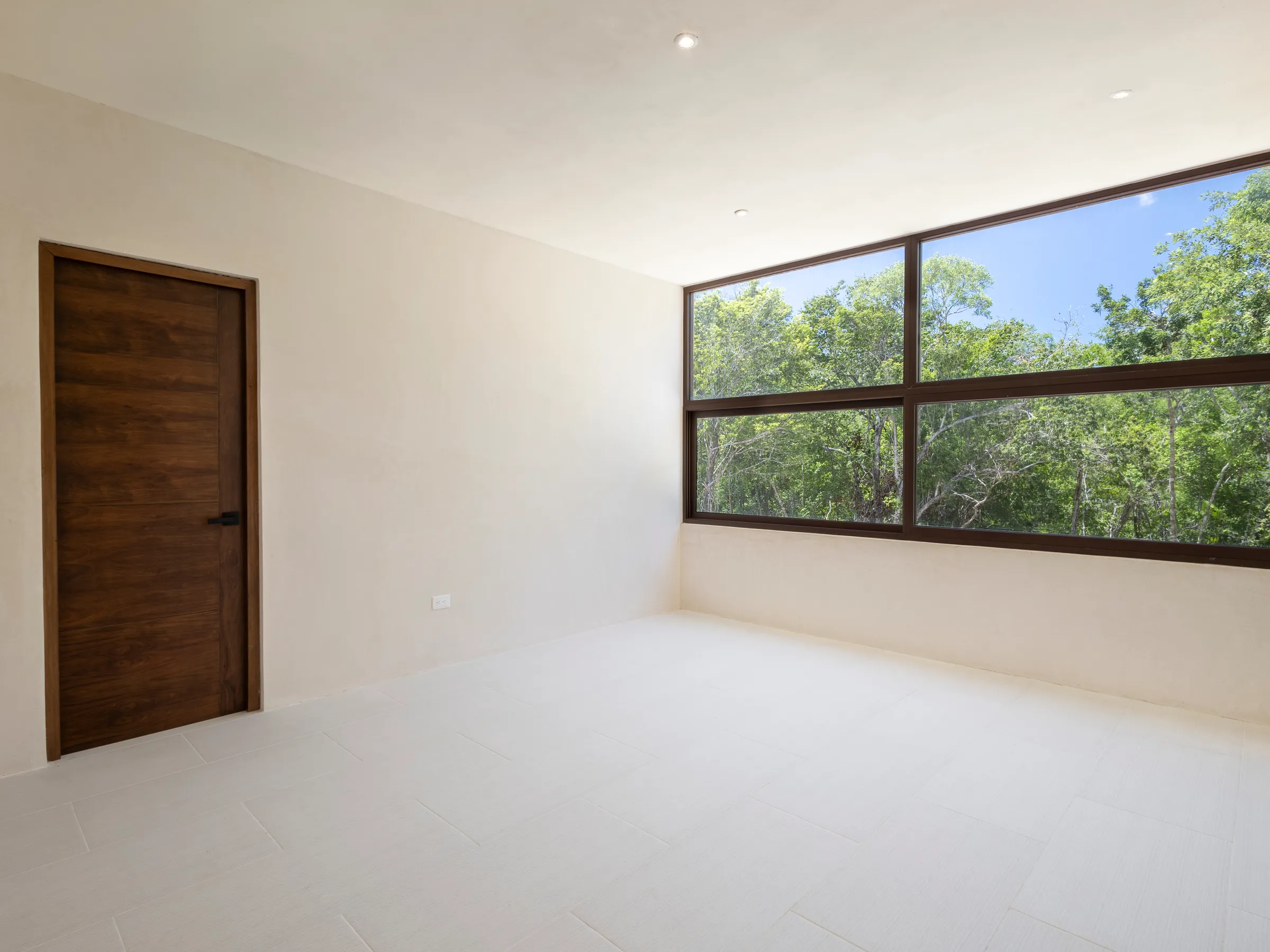 Chambre de la Villa Quetzal avec grande fenêtre sur la jungle